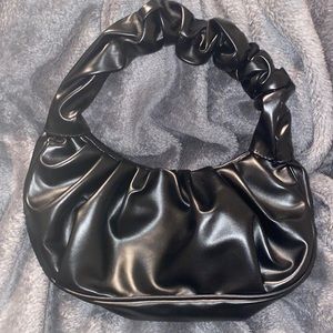 black scrunch hand bag